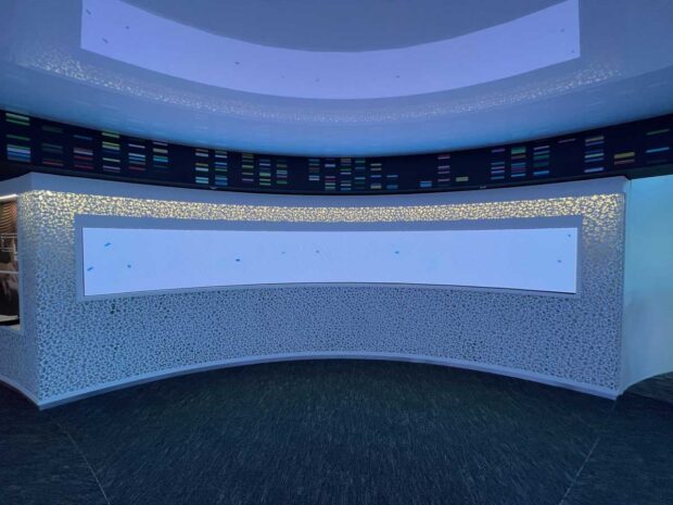 Impressive curved LED display structure in corporate lobby.