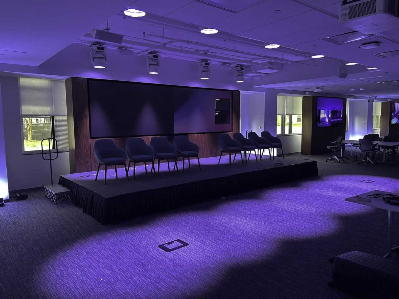 Purple lighting in meeting room with 8x4 Floor-to-ceiling visual structure to hold 32 Front Service LEDs using RPV fixed mounts in background